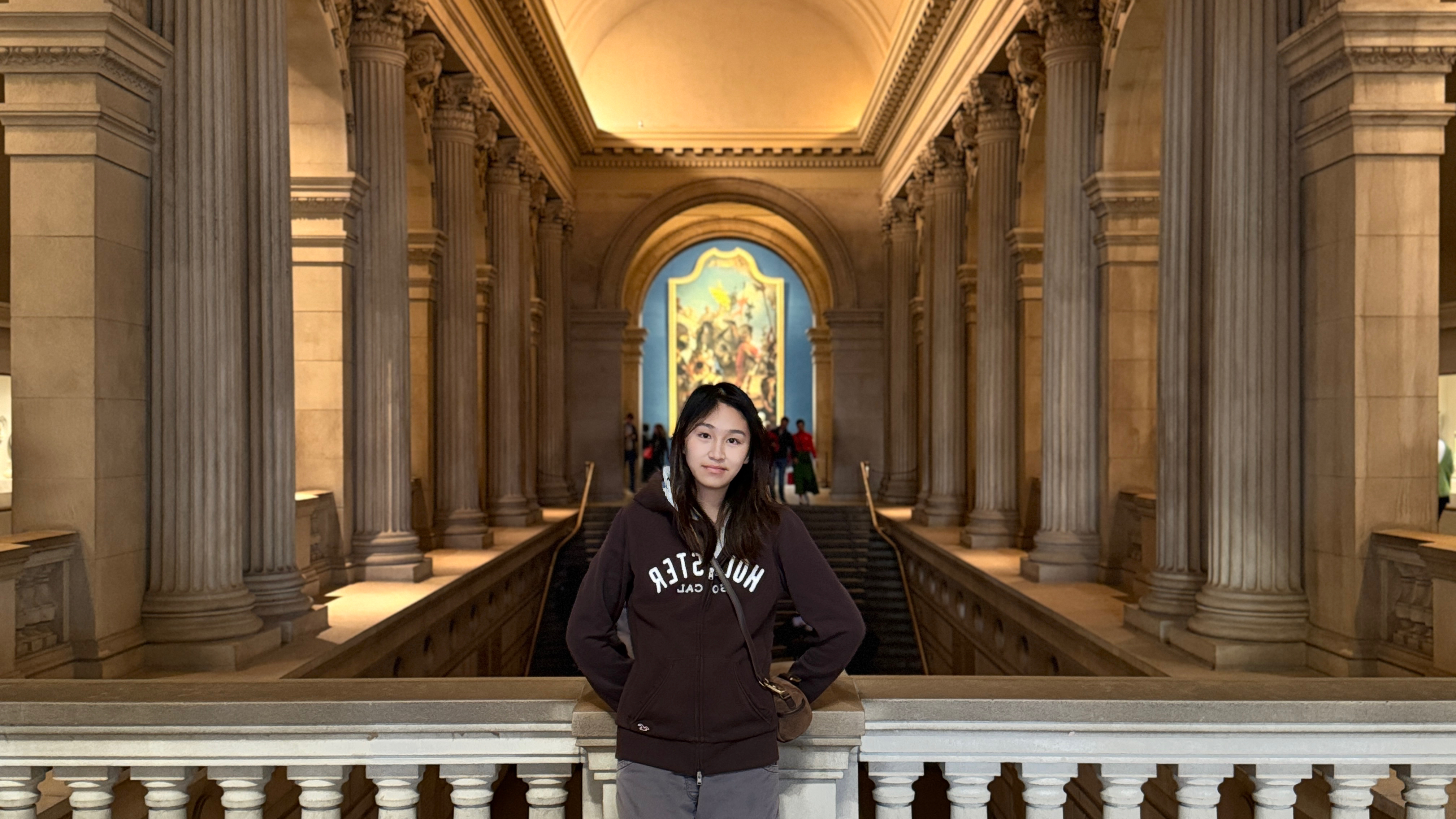 Linda Xu standing in a museum gallery